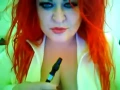 When smokin', this red-haired seductress with big whoppers looks so hot.